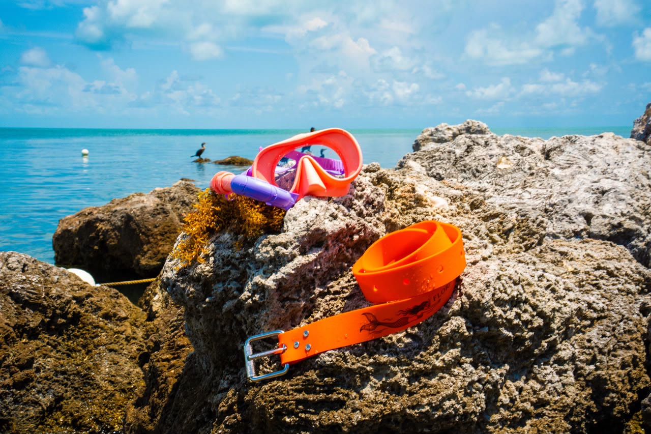 Florida Mermaid dive belt and mask on the rocks